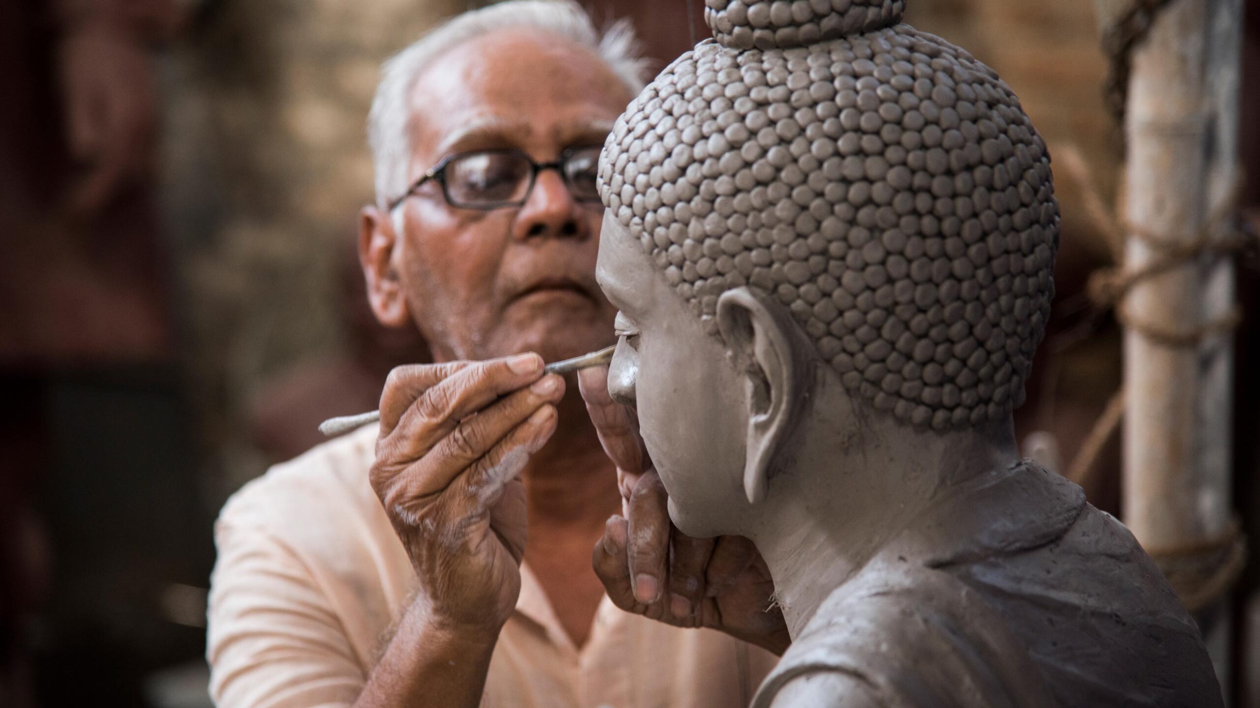 Newar artisan crafting traditional metalwork in Kathmandu Valley workshop, Nepal cultural heritage