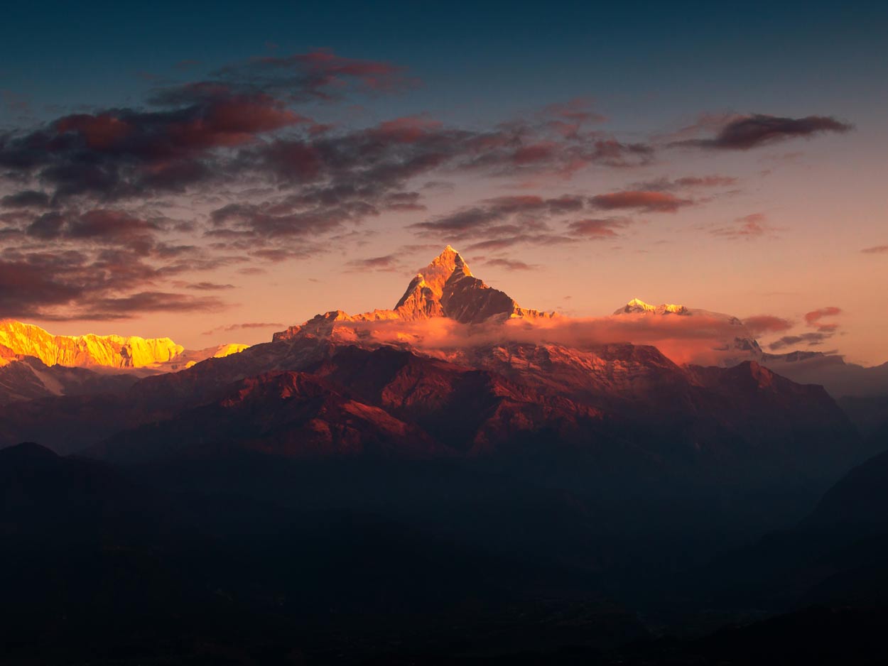 Panoramic Himalayan mountain sunrise view from Annapurna region with snow-capped peaks